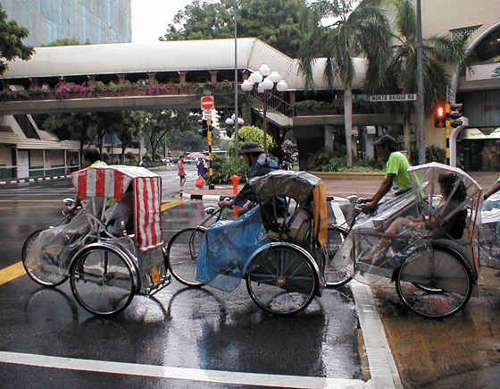 Trishaws in rain